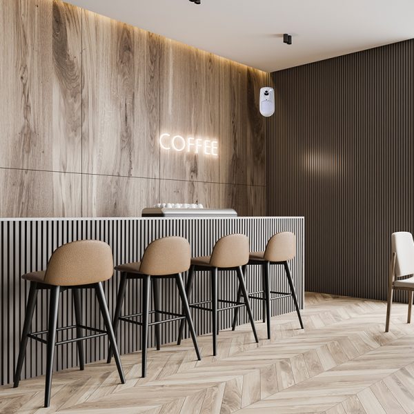 Bar con bancone bianco, sedie alte e pareti in legno e righe. Luminoso.